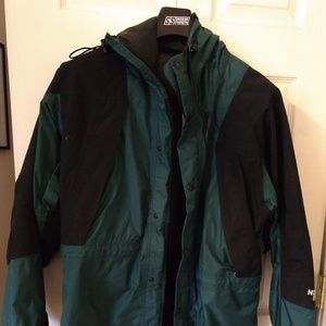 Green North Face rain coat medium